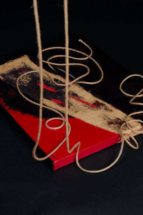 Red and black oil painting with mixed media -- natural fabric and rope on painting. Art piece by New York artist, Anne Vandycke.