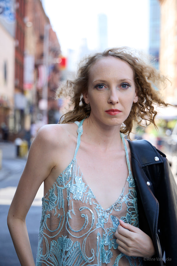 Woman standing on a city street. New York City Photoshoot by Anne Vandycke.