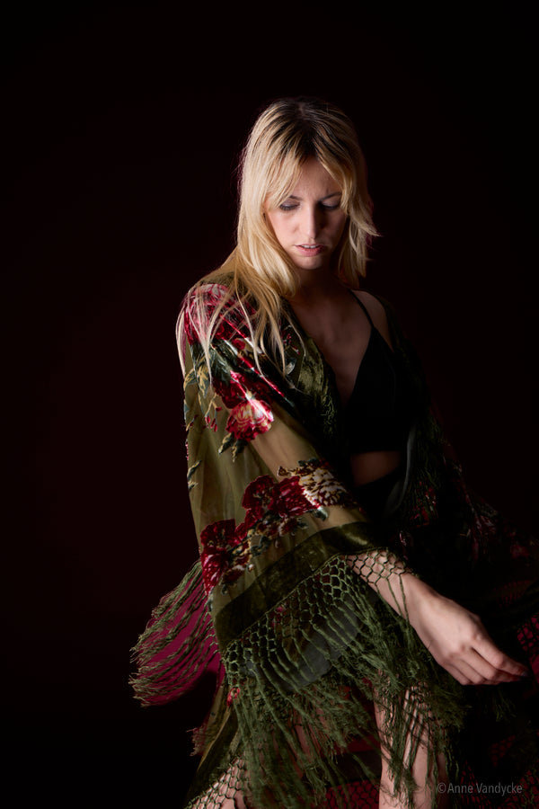 Woman wearing a floral kimono against a dark background. New York studio photography by Anne Vandycke.