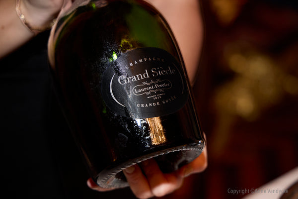 Luxury Grand Siècle Champagne served during prestigious Order des Coteaux de Champagne ceremony hosted by Laurent Perrier in NYC. Photo taken by event photographer, Anne Vandycke.