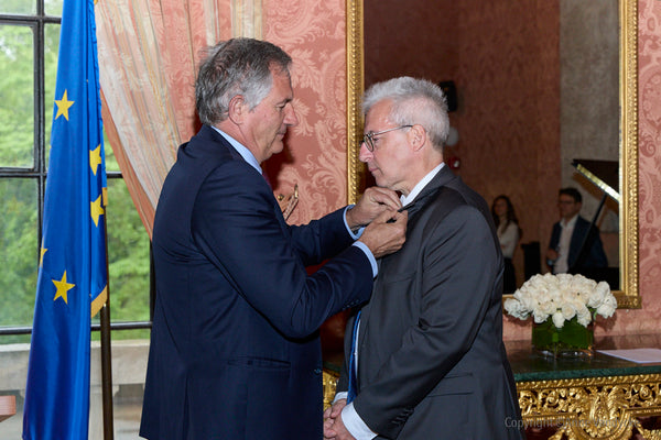 Laurent Billi, Ambassador of France to the United States, awarding the Legion of Honor to Jean-Hugues Monier. Event Photo by NYC Photographer, Anne Vandycke.